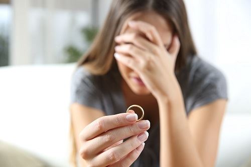 woman holding ring